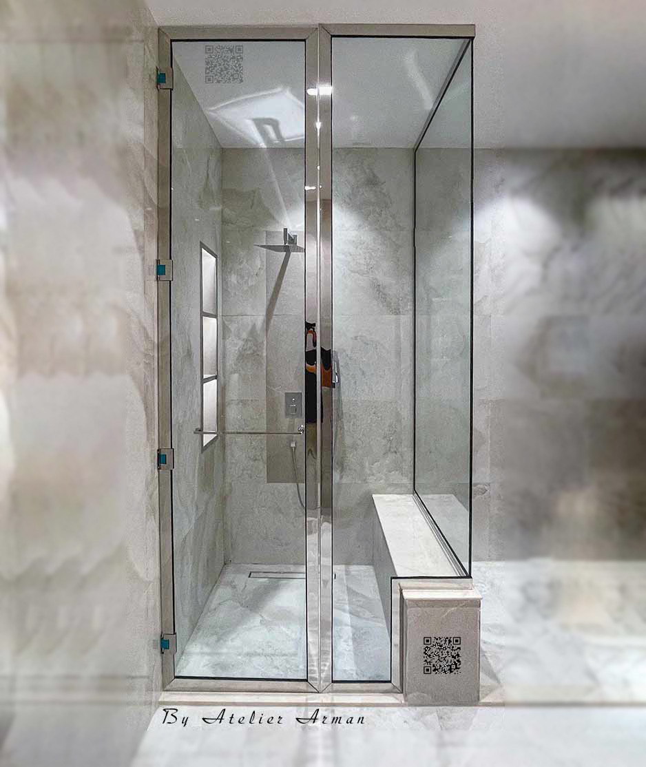 A bespoke, neo-classic shower enclosure with a mirror-finish stainless steel frame and glass, custom-made in Dubai and installed in a luxury mansion in Abu Dhabi.